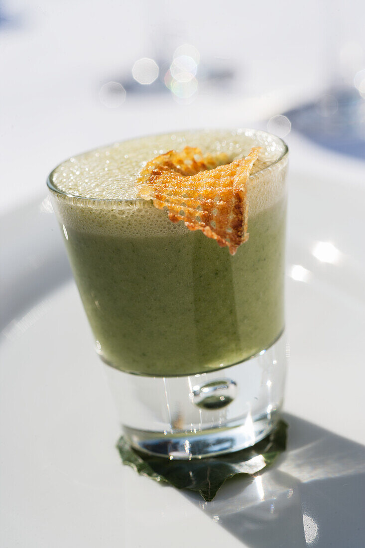 Spinach soup in a jar with potato lattice
