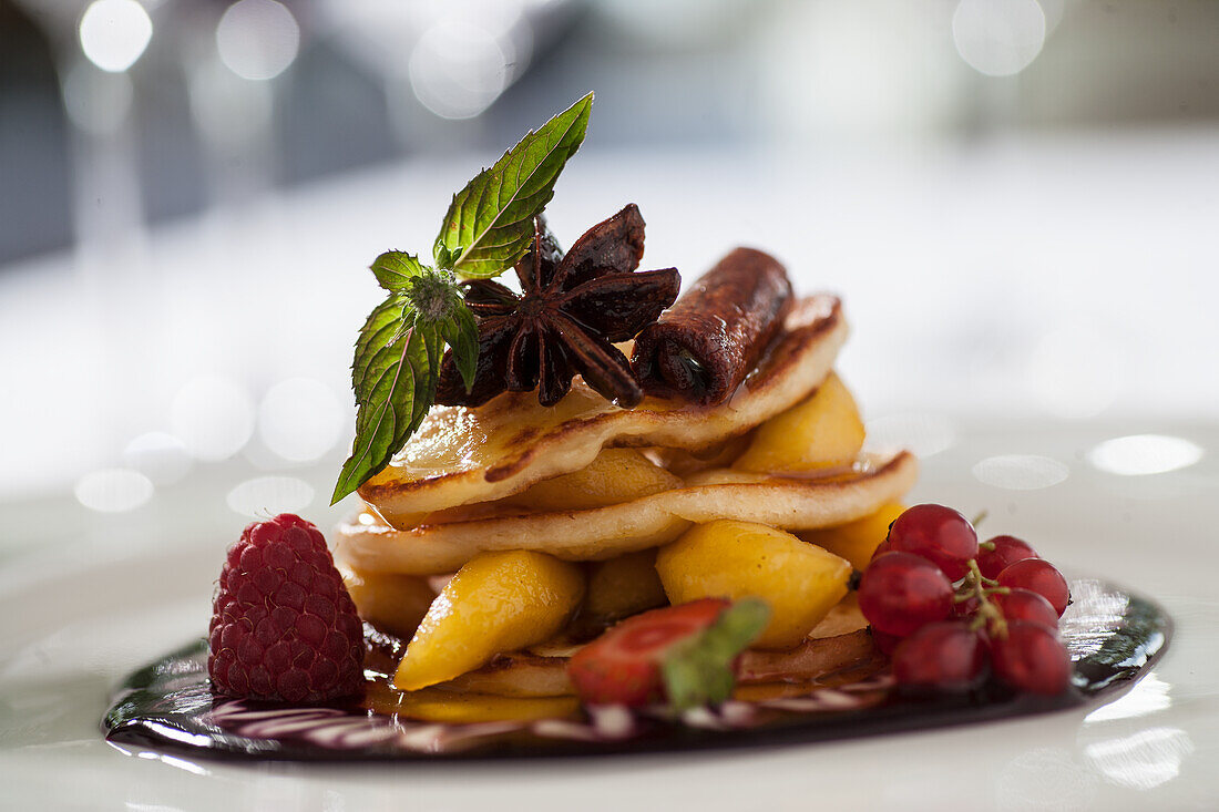 Quark patties with fruit on a chocolate topping