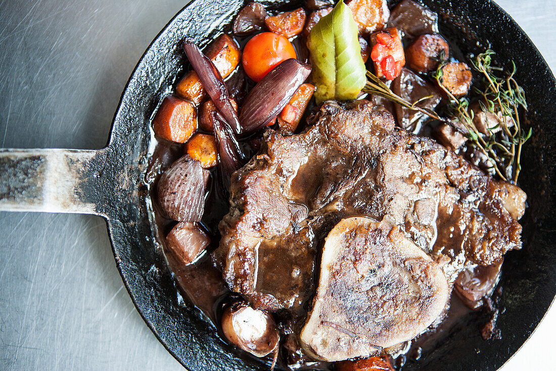 Braised knuckle of pork with root vegetables