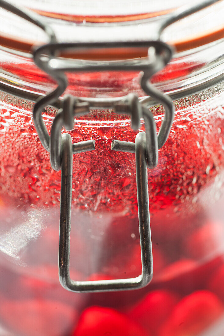 Raspberry schnapps preparation in a glass jar