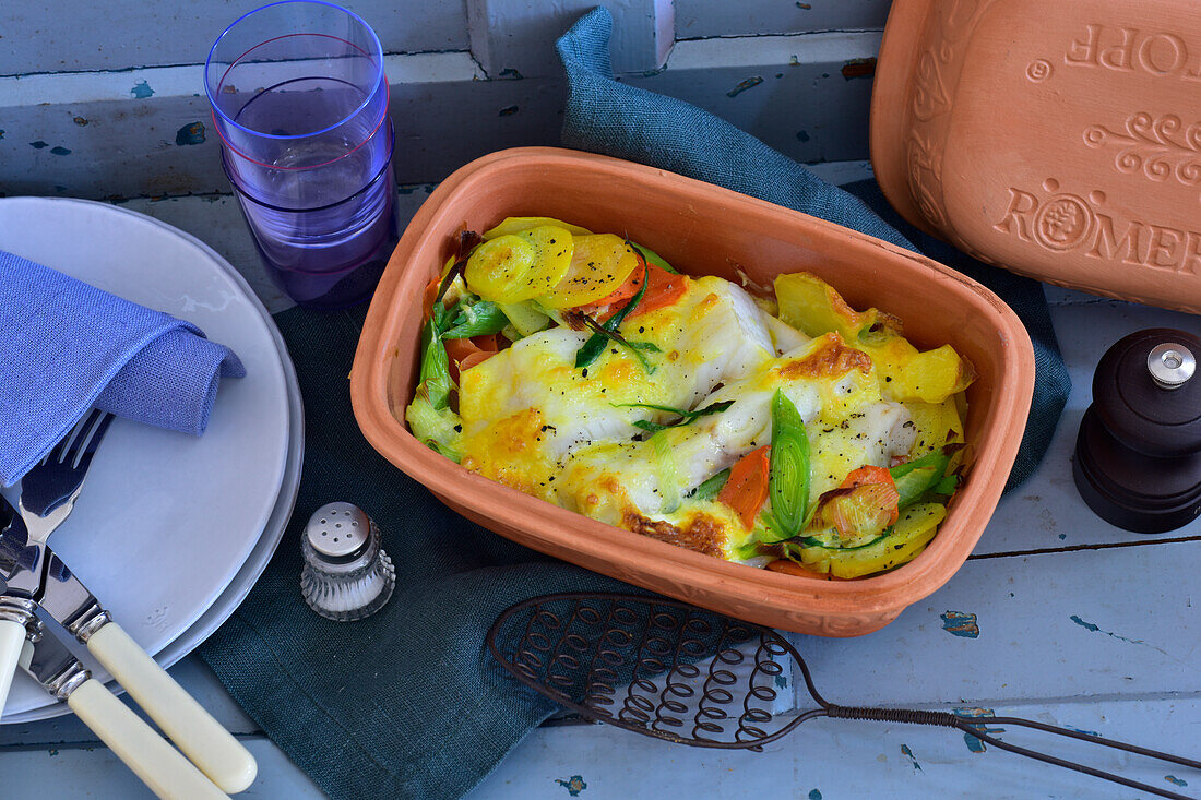 Cod with mustard crust and vegetables from the Roman pot