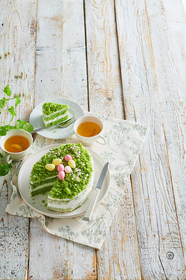 Green egg-shaped Easter cake with mascarpone cream