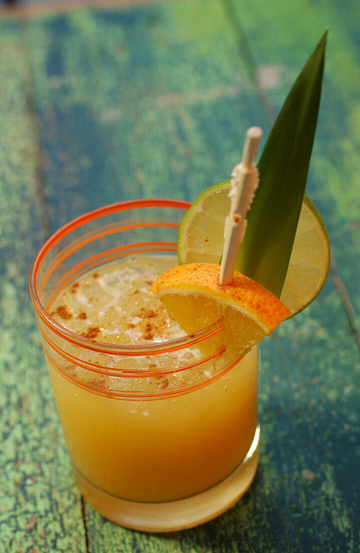 Goldrush cocktail with mango syrup, apple juice and melon