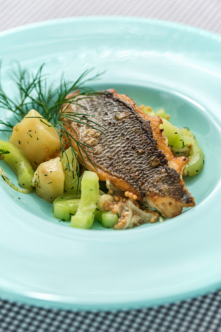 Sea bream with mustard dill potatoes and cucumber vegetables