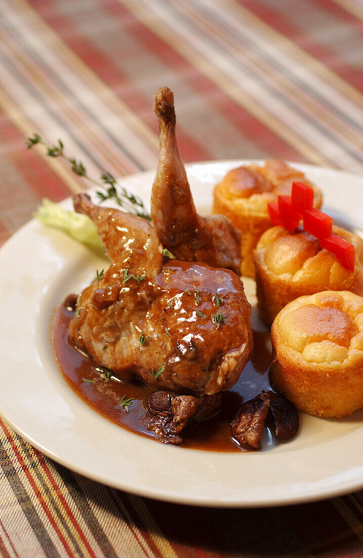 Quail with shiitake sauce and corn rolls