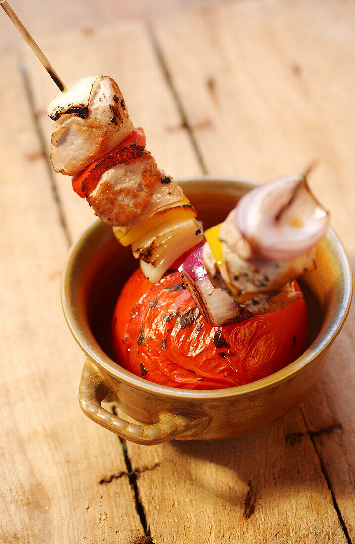 Souvlaki skewers with grilled tomato