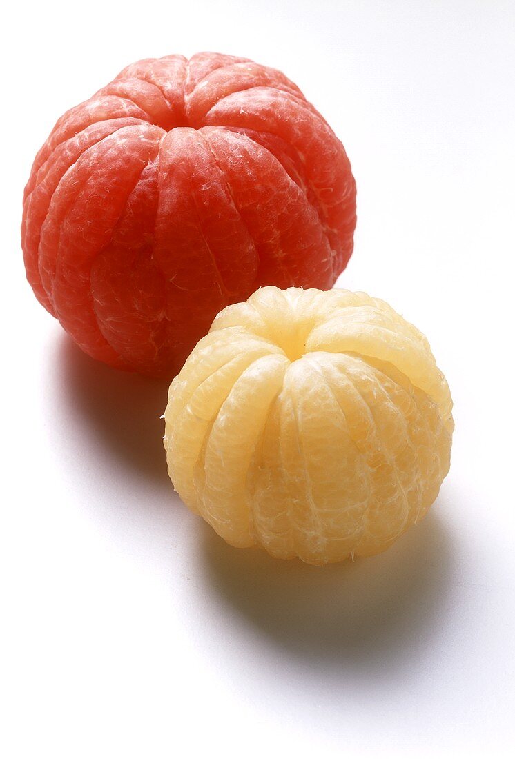 Pink grapefruit and yellow grapefruit, both peeled