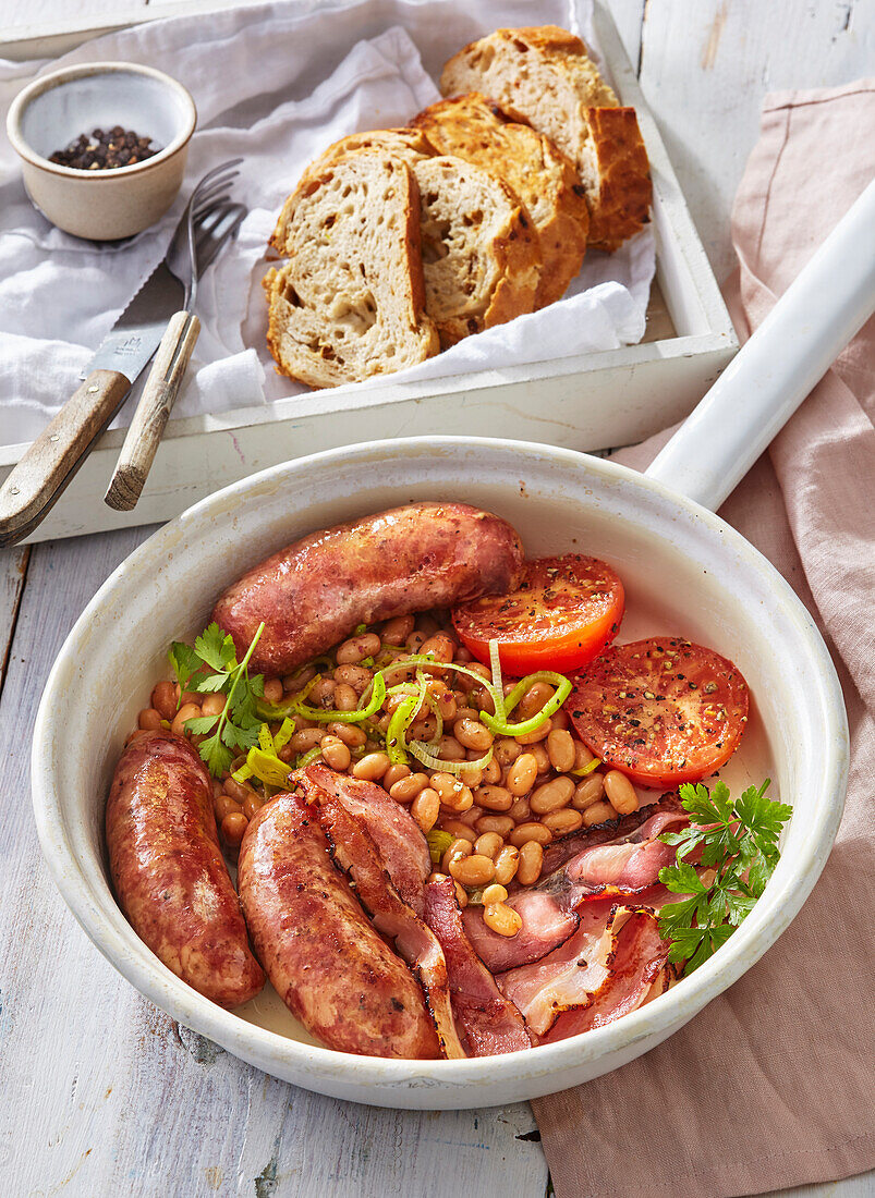 English breakfast with sausages, bacon and beans