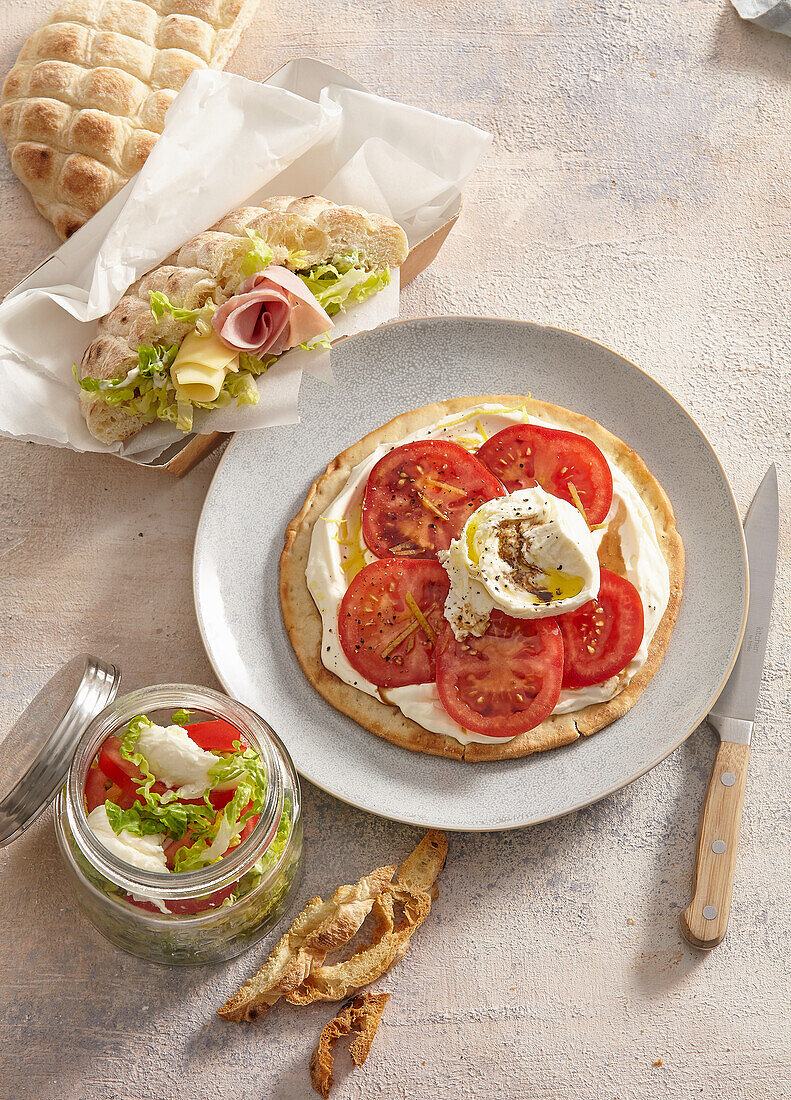 Pita pizza, salad in a jar and sandwich