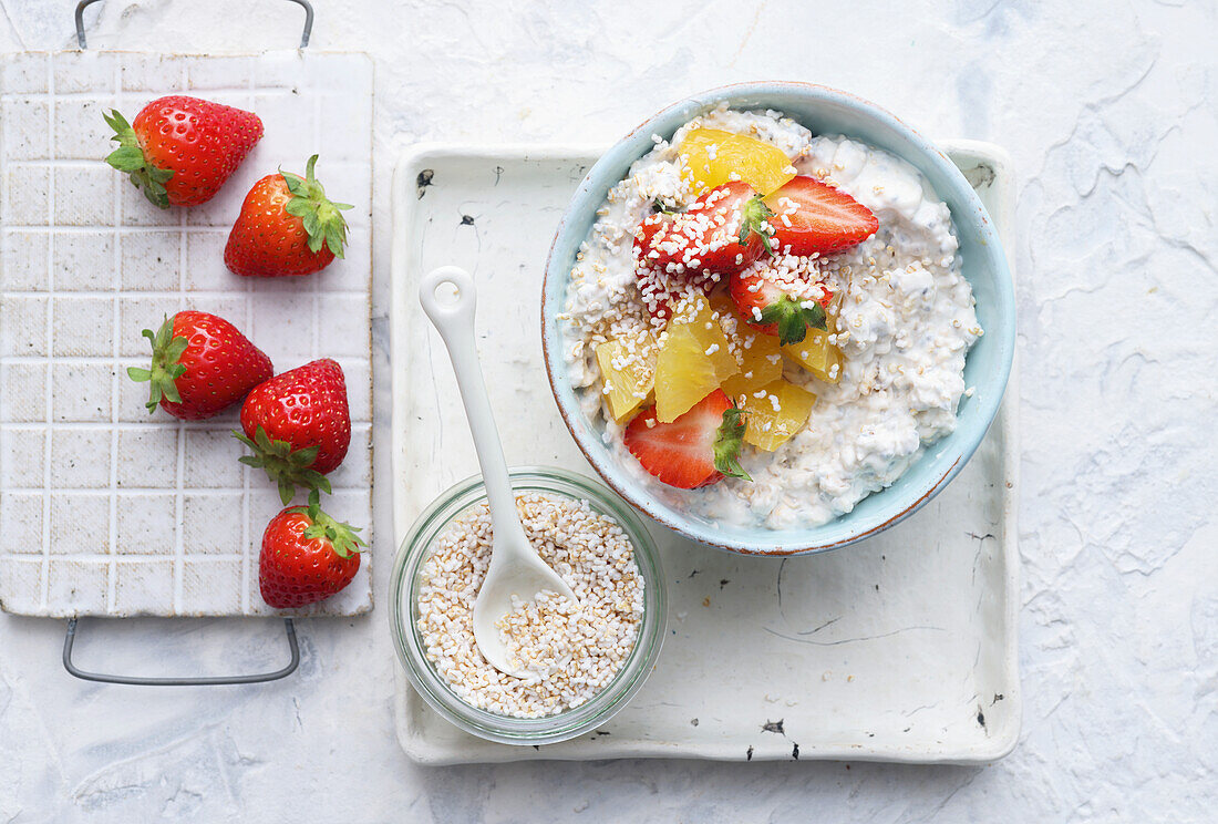 Muesli with fresh strawberries and pieces of mango