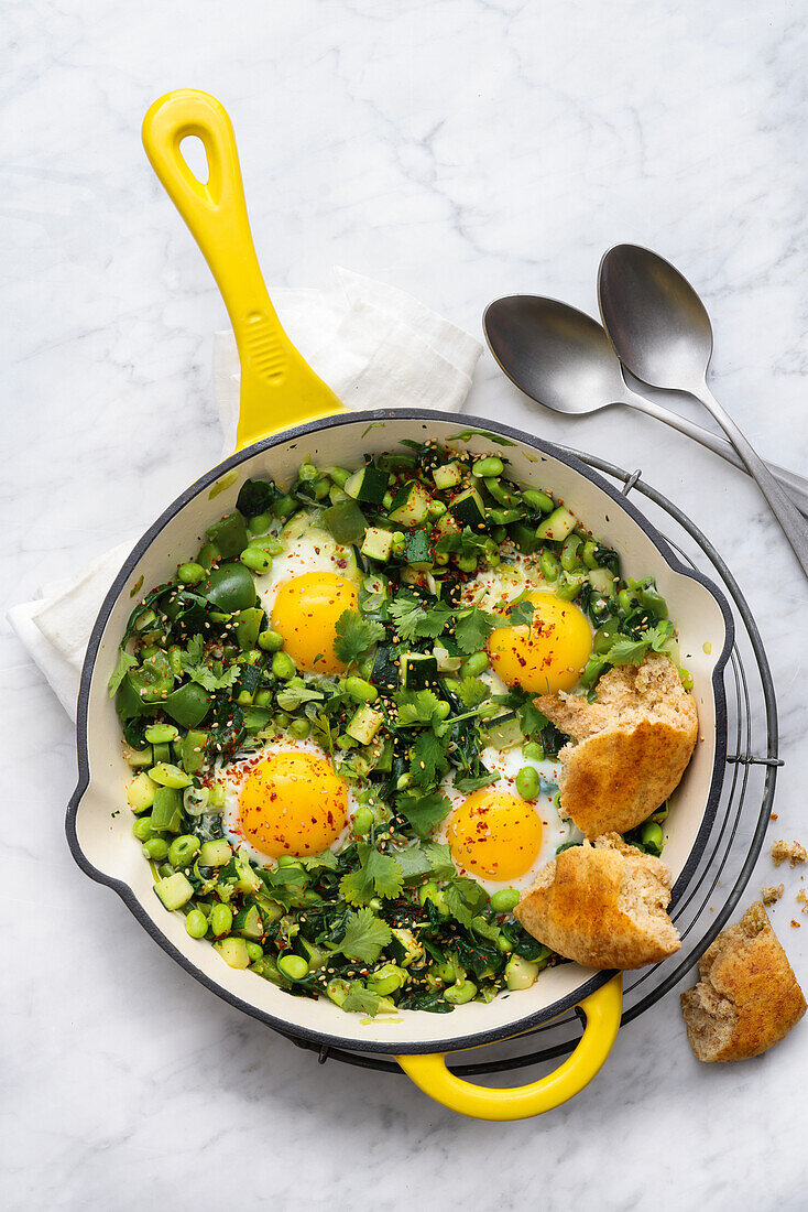 Green shakshuka with fresh herbs