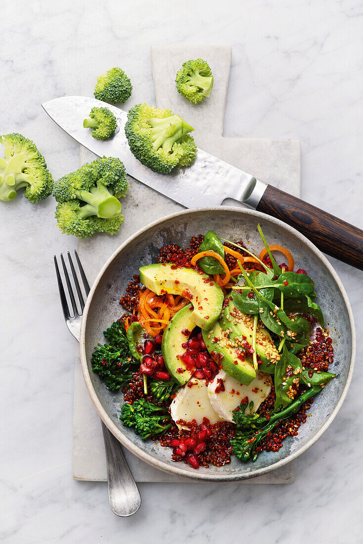 Quinoa salad with avocado, broccoli and pomegranate seeds