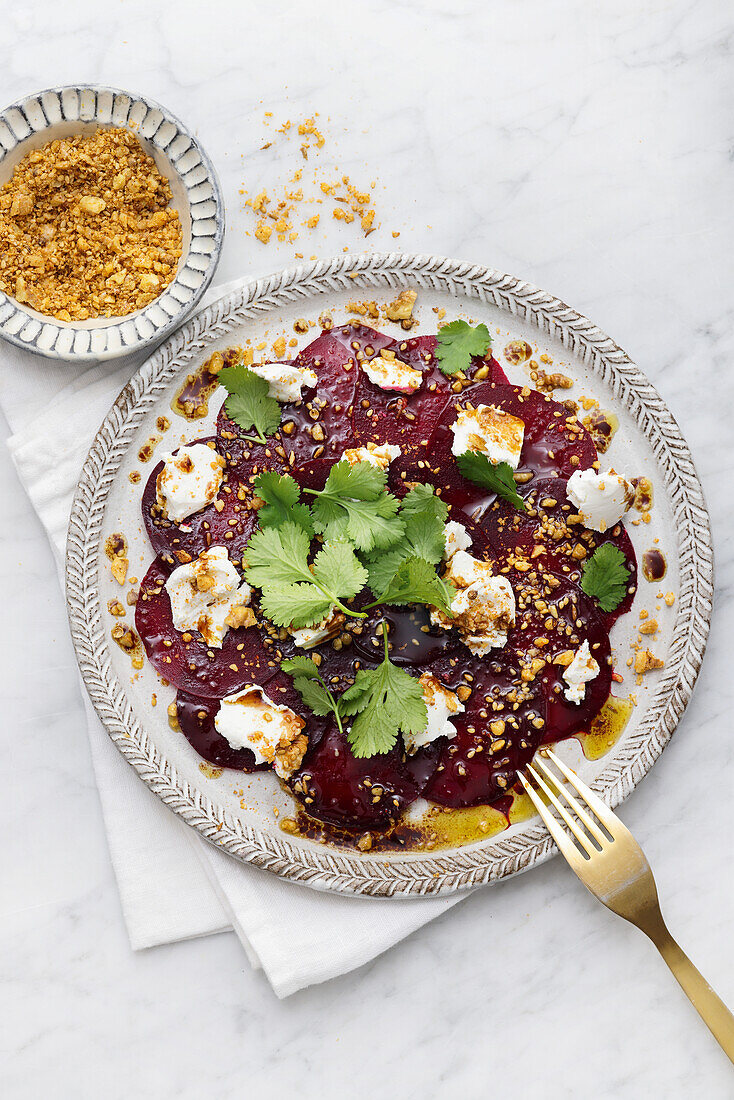 Beetroot carpaccio with goat's cheese and nuts