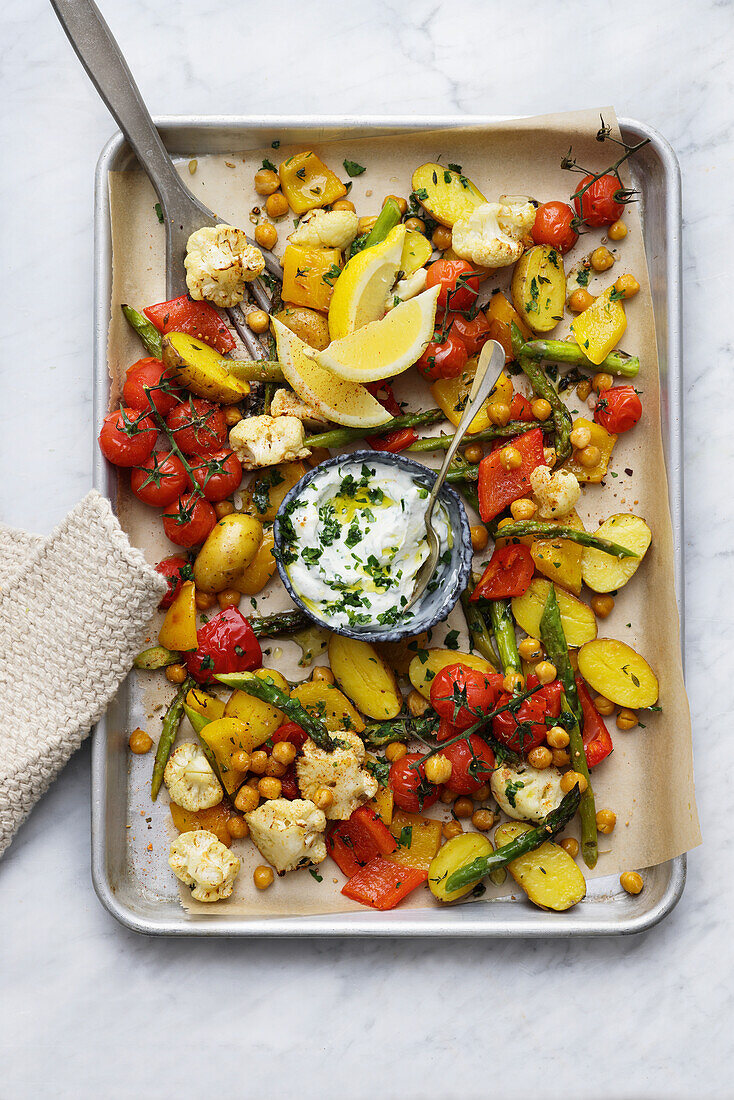 Oven-roasted vegetables and chickpeas with yoghurt dip