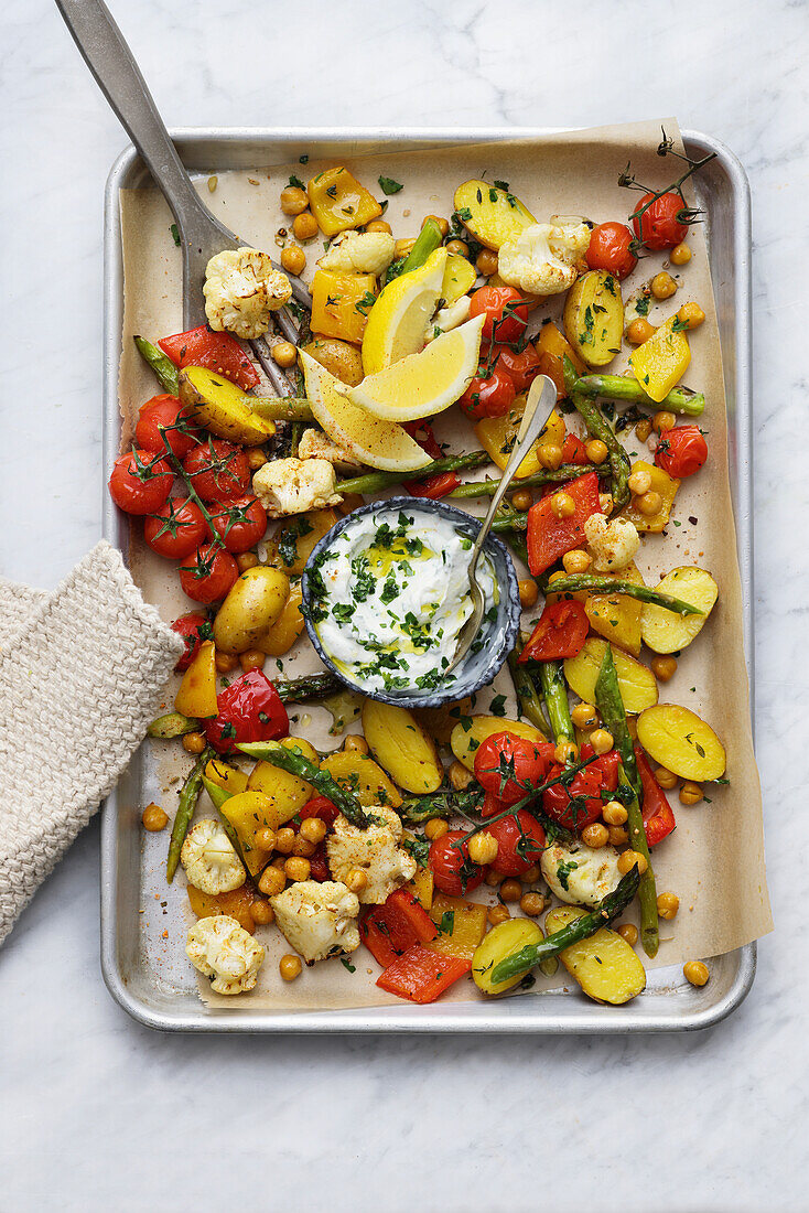 Oven-roasted vegetables with yoghurt dip and chickpeas