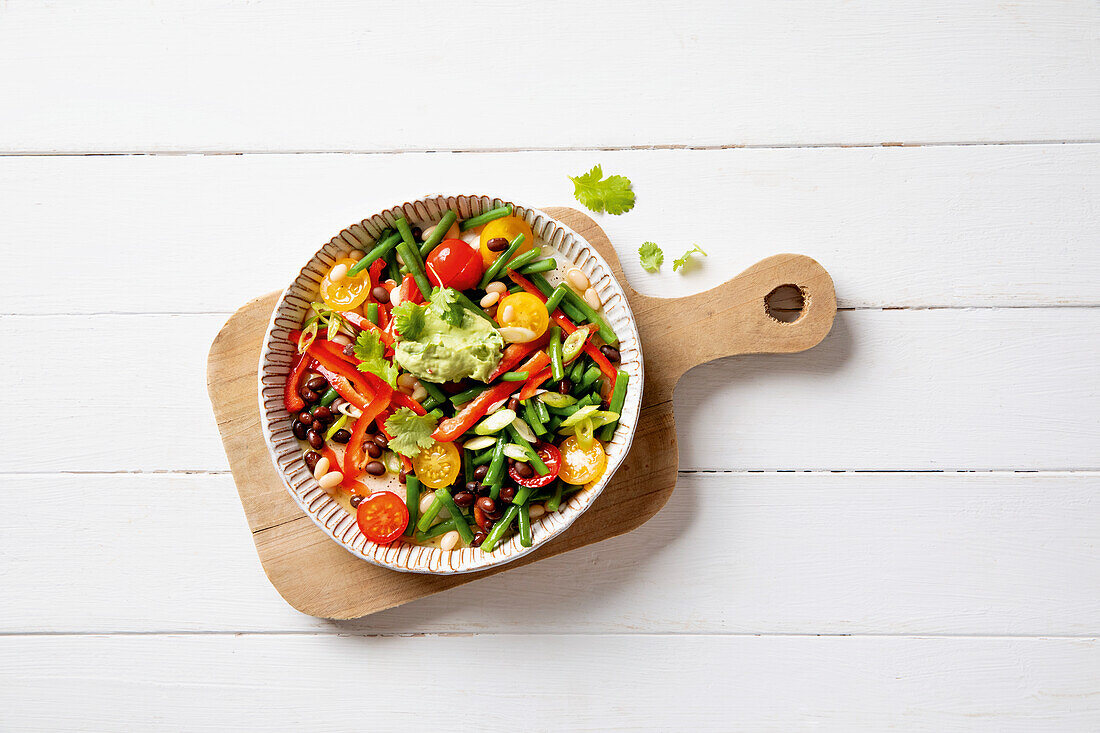 Coloured bean salad with vegetables and avocado