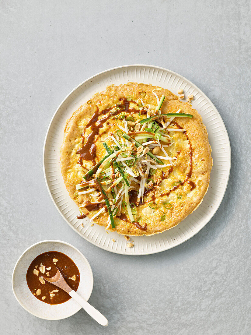 Thai tofu omelette with peanut sauce and sprouts