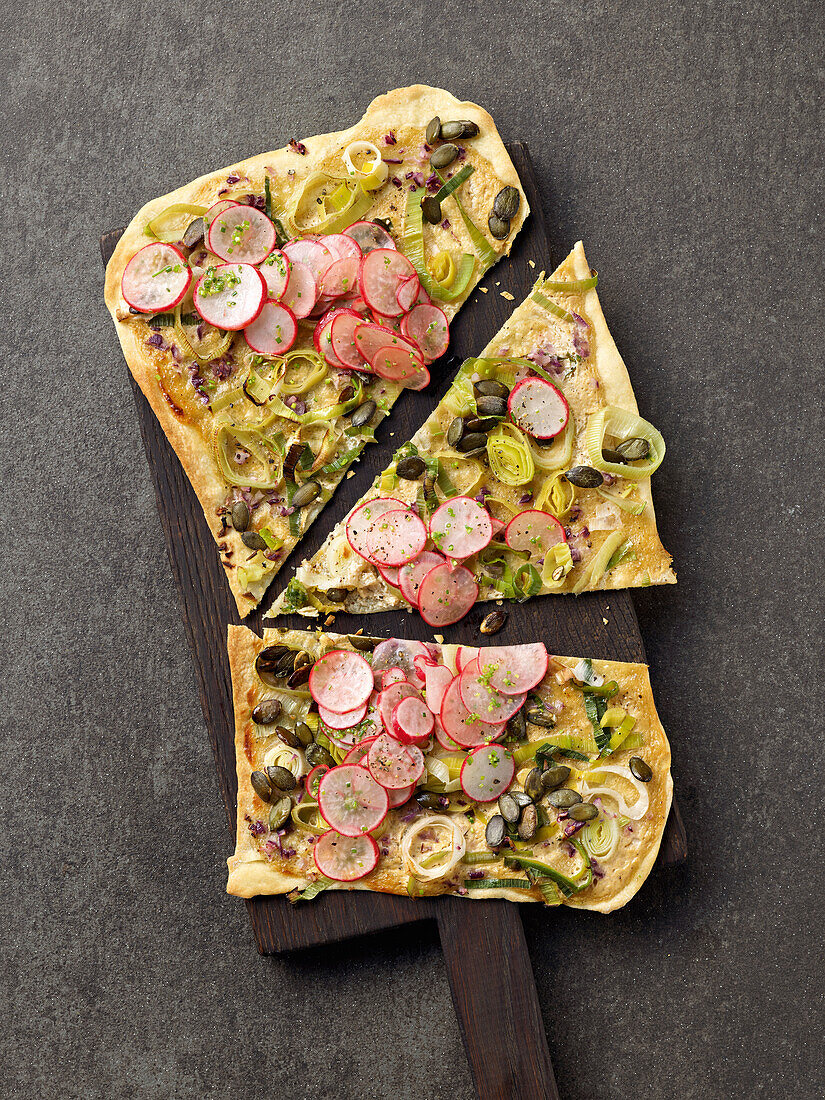 Tarte flambée with leek, radishes and capers