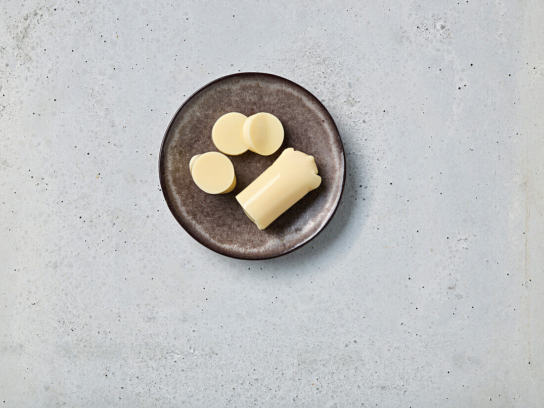 Portioned pieces of butter on a plate