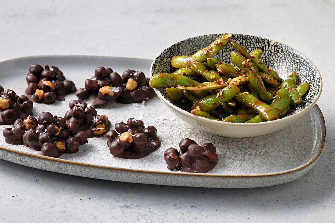 Chocolate bites and edamame with sesame seeds