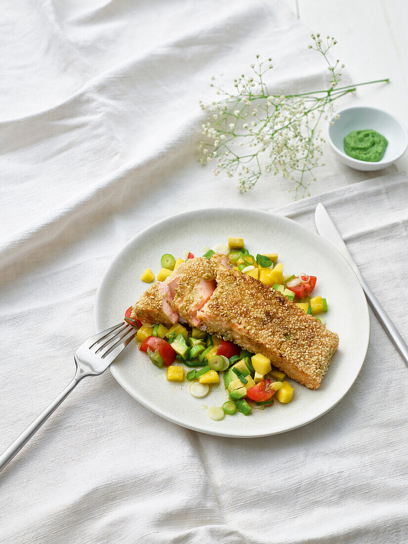 Sesame salmon on a mango and vegetable salad