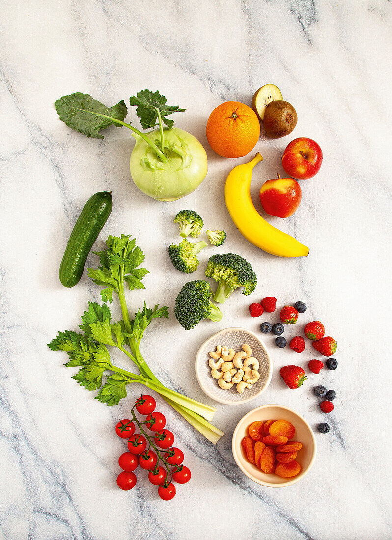 Various types of fresh fruit and vegetables with nuts