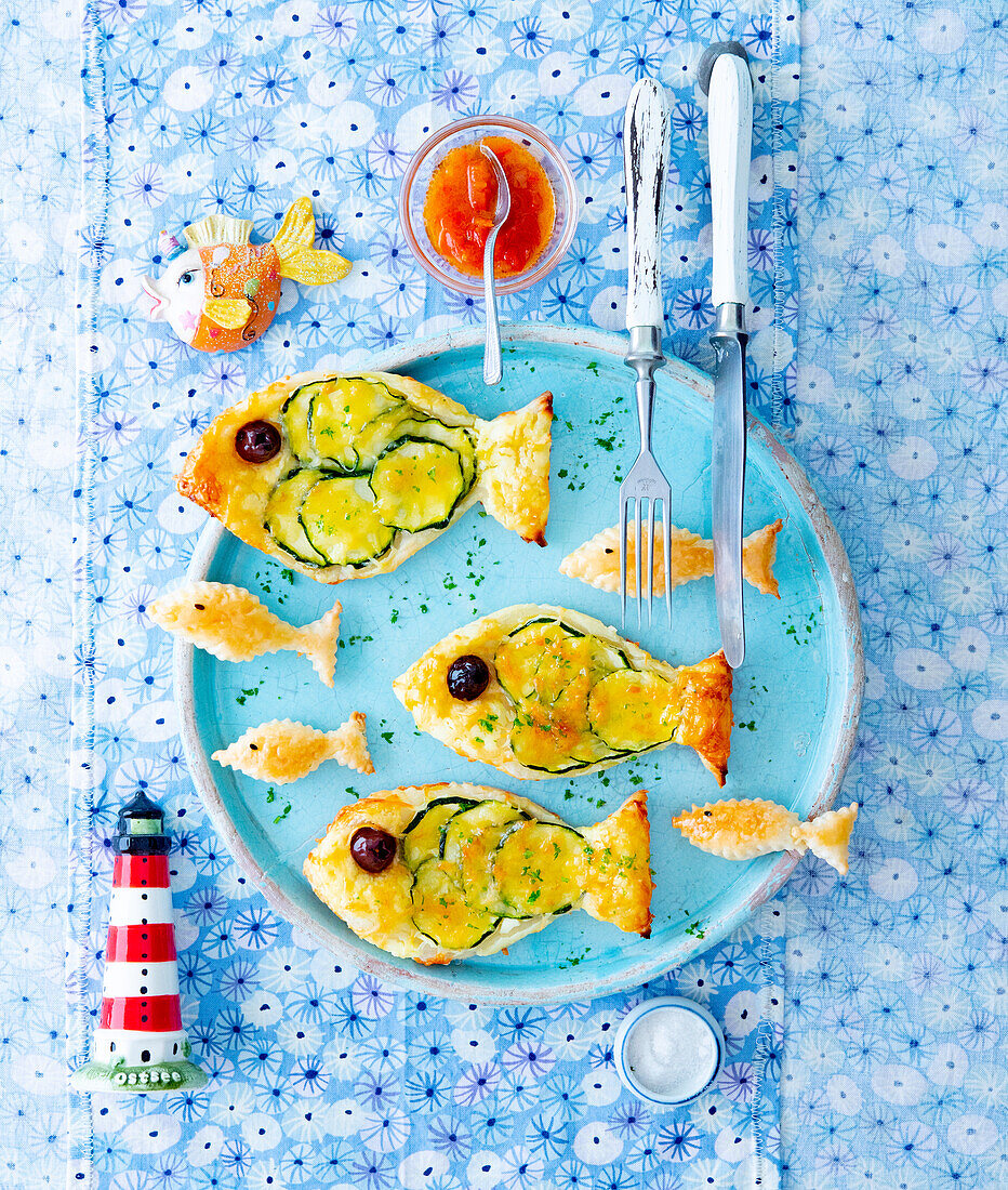 Puff pastry courgette fish with olive garnish