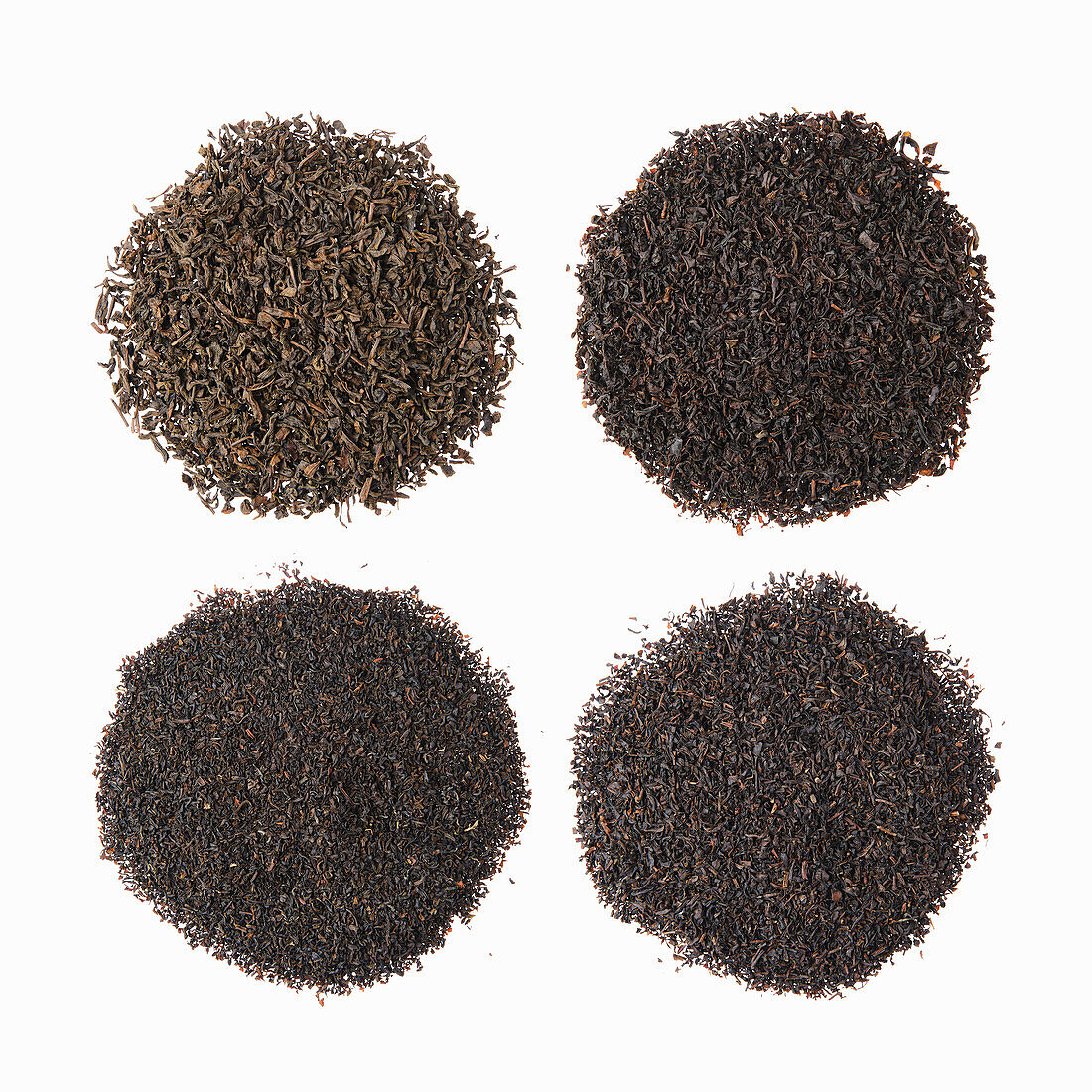 Different types of black tea on a white background