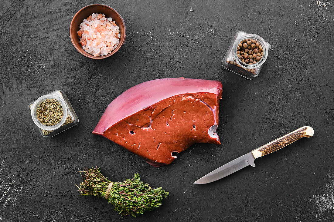 Raw beef liver with spices and herbs