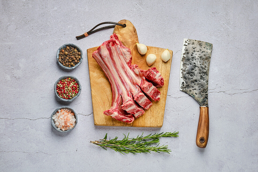 Raw venison ribs with pepper, salt and rosemary