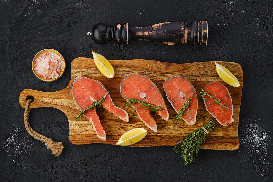 Raw salmon steaks with lemon and rosemary