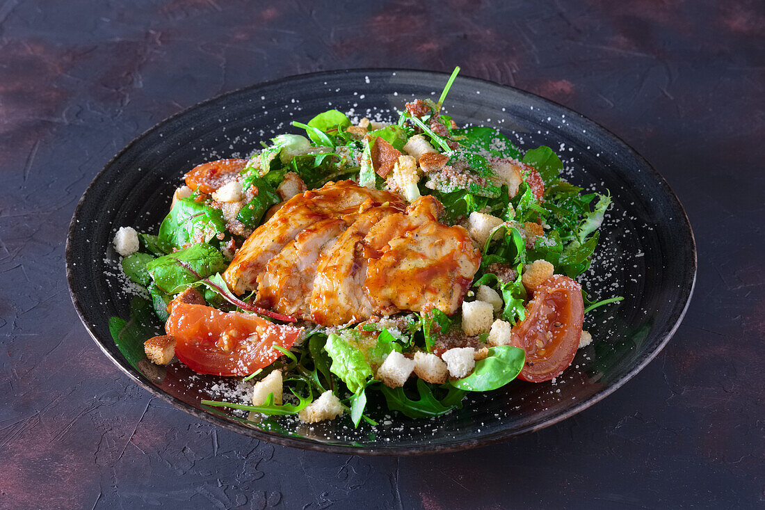 Fresh salad with roasted turkey fillet and croutons