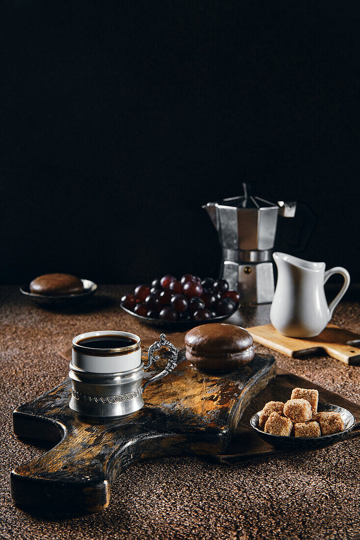 Espresso with chocolate cake and grapes