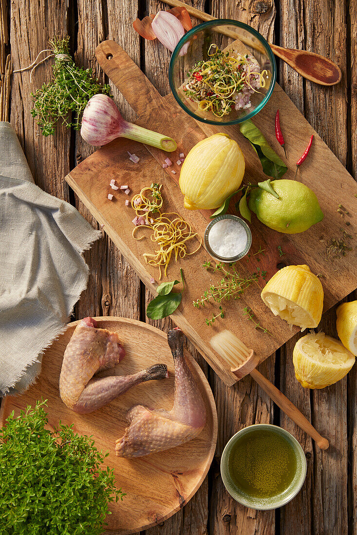 Preparation of black-feathered chicken with lemons and herbs