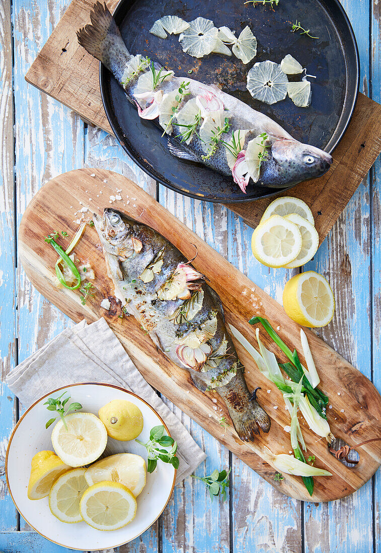 Trout with lemon slices and herbs