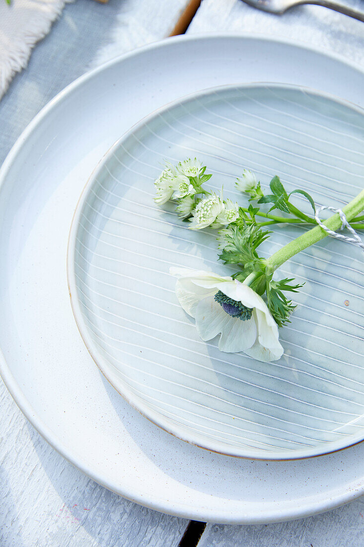 Flower arrangement on a white plate