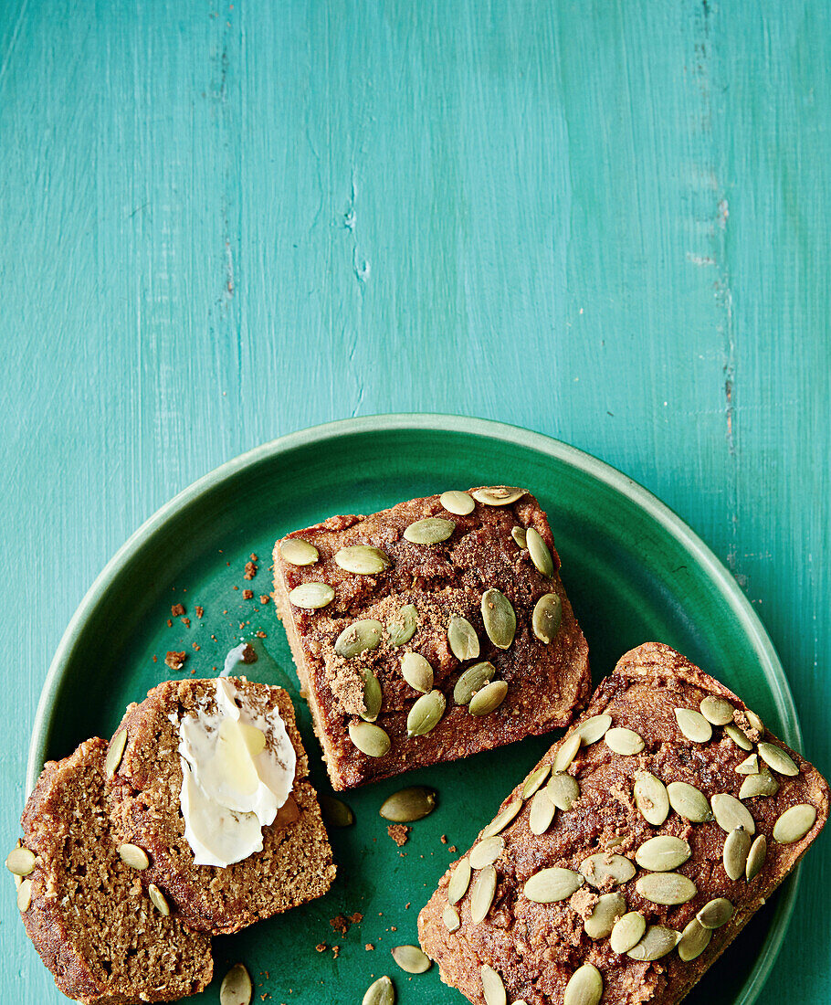 Spice cake with pumpkin seeds and butter