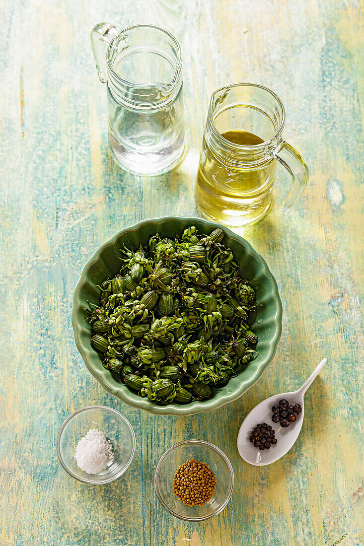 Ingredients for dandelion capers; dandelion buds, vinegar, salt, spices