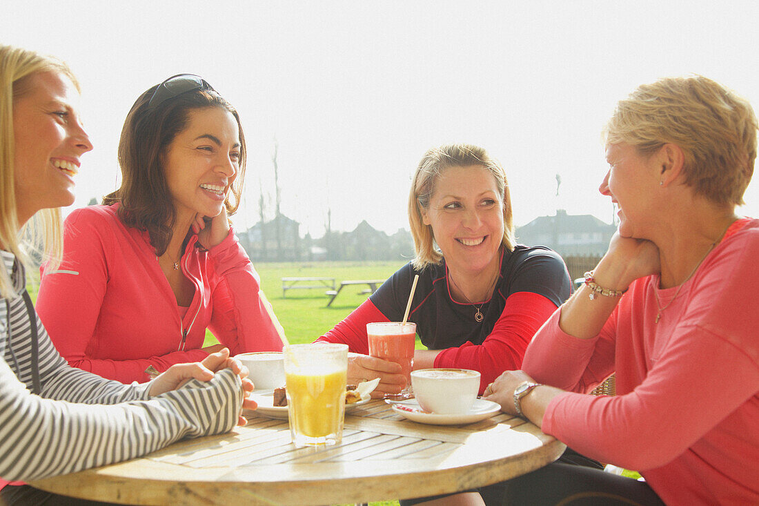 Women Having Breakfast at Outdoor Cafe