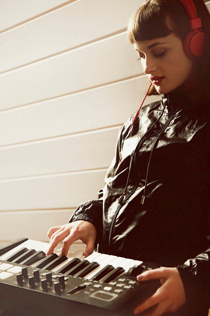 Teenage Girl Playing Synthesizer