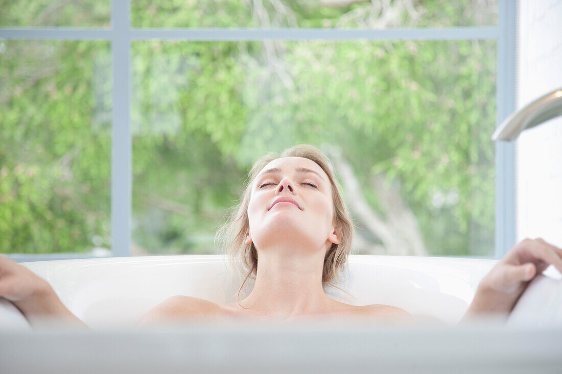 Woman Relaxing in Bathtub