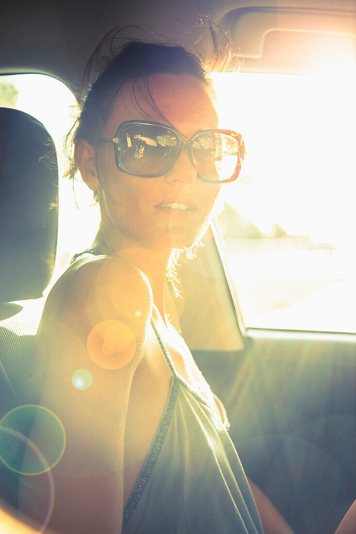 Woman Inside Car at Sunset