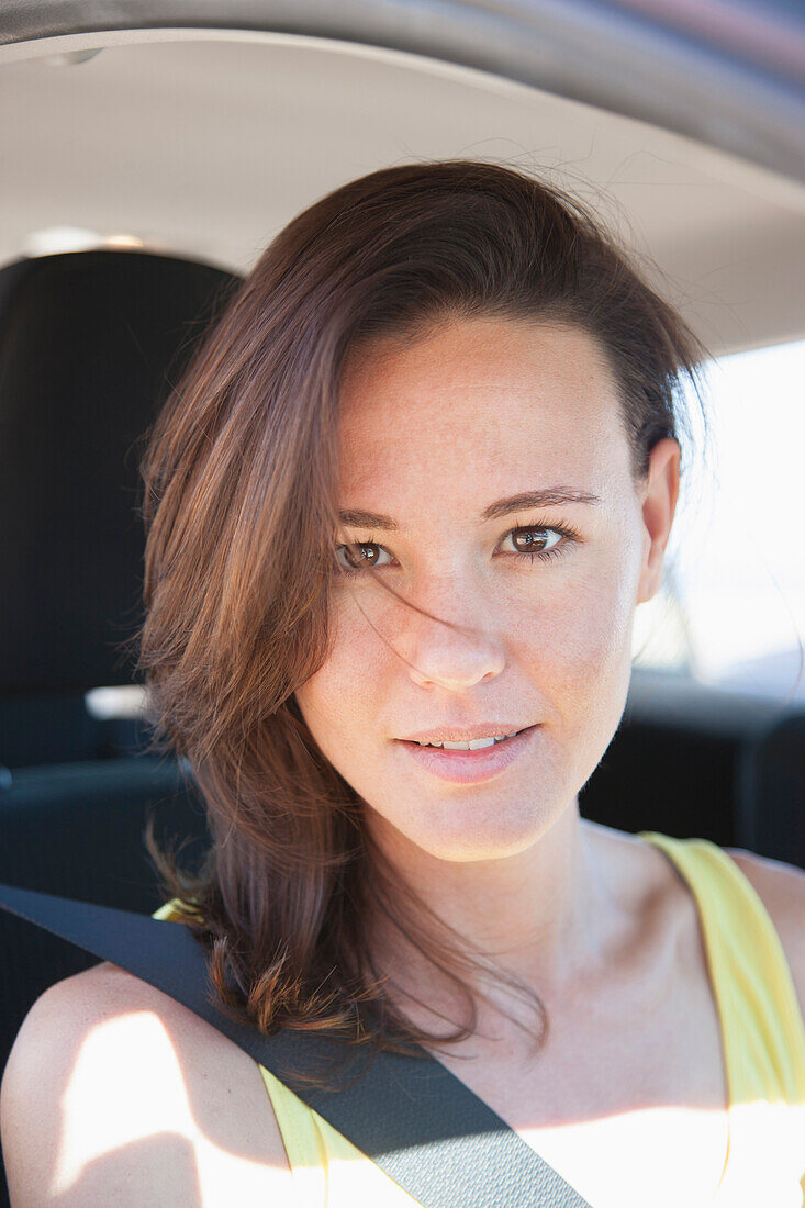 Young Woman Inside Car Wearing Seat Belt