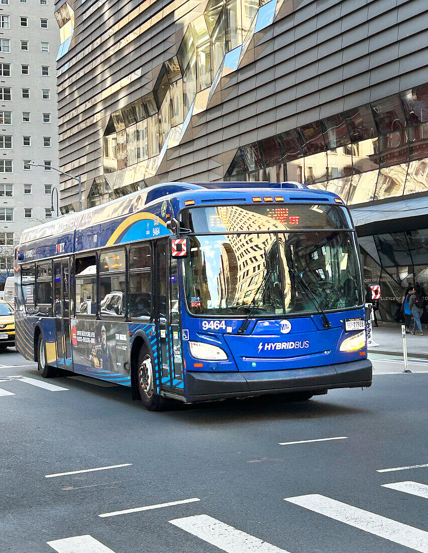 Street scene with hybrid Bus, New York City, New York, USA