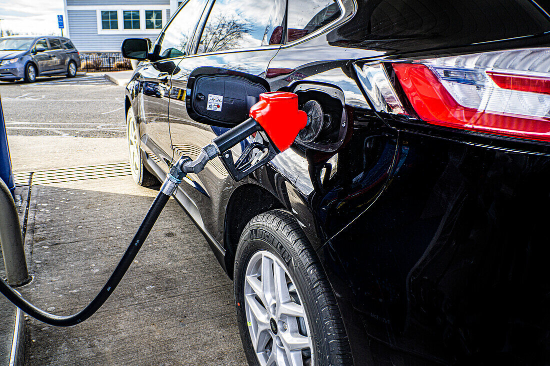 Car refueling at gasoline pump