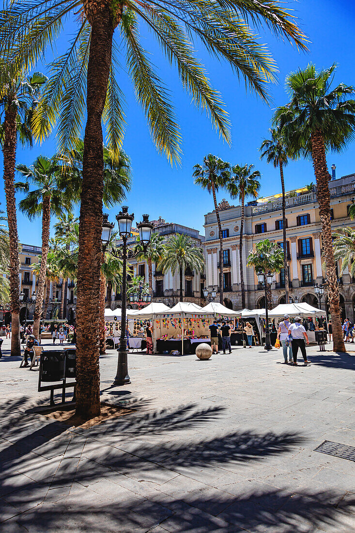 Barcelona,Spain - June 01 - 2019: Reial Square (Royal Square),one of the busiest squares in Barcelona,Spain,is located in the Barri Gothic district,near Las Ramblas.