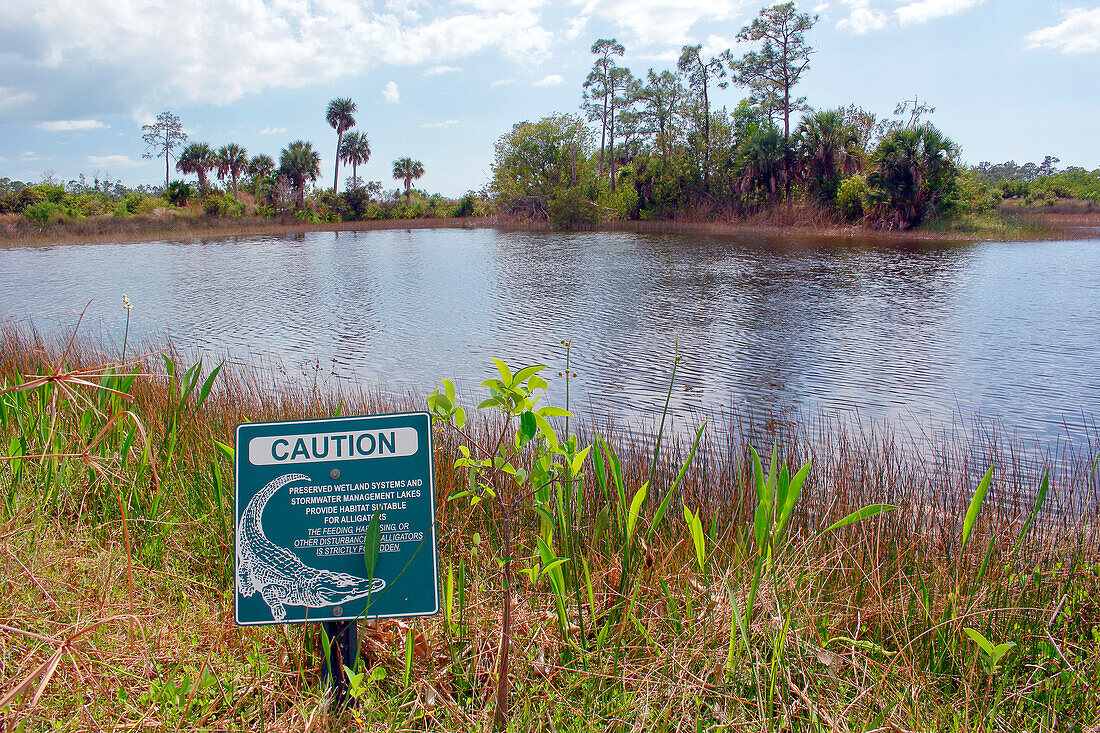 USA. Florida. Naples. Naples Botanical Garden. Danger sign for alligators.