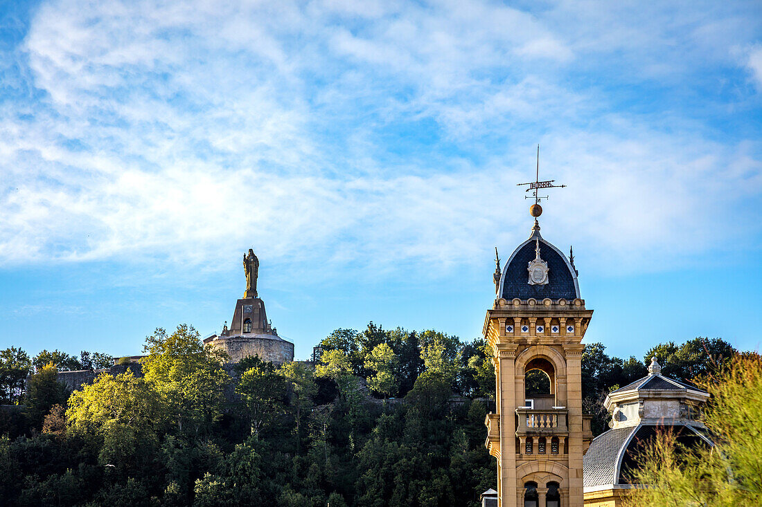 San Sebastián,Spain - 07 September 2019 - View of the statue of the Sacred Heart and a church steeple