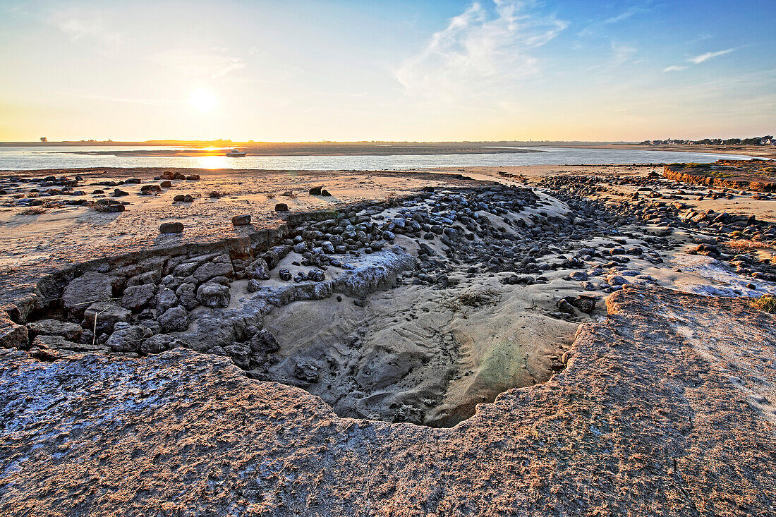 France. La Manche. Montmartin sur Mer,haven of Regneville sur Mer. Sunset. Area of erosion of beaches and dunes due to tides.