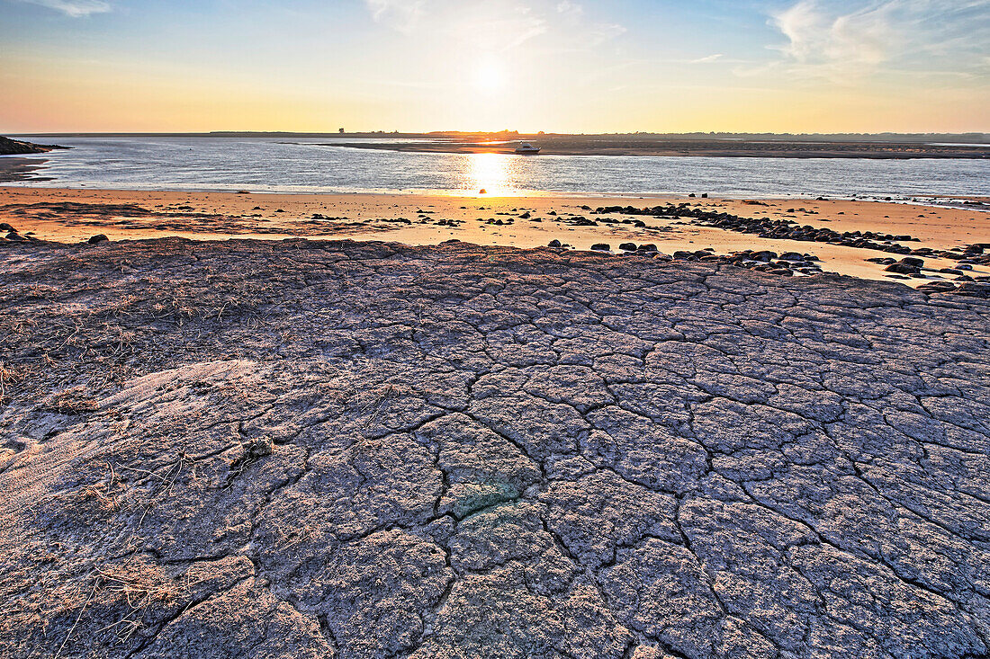 France. La Manche. Montmartin sur Mer,haven of Regneville sur Mer. Sunset. Area of erosion of beaches and dunes due to tides.